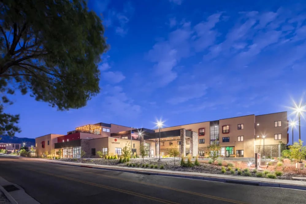 Exterior view of Amaran Senior Living at dusk