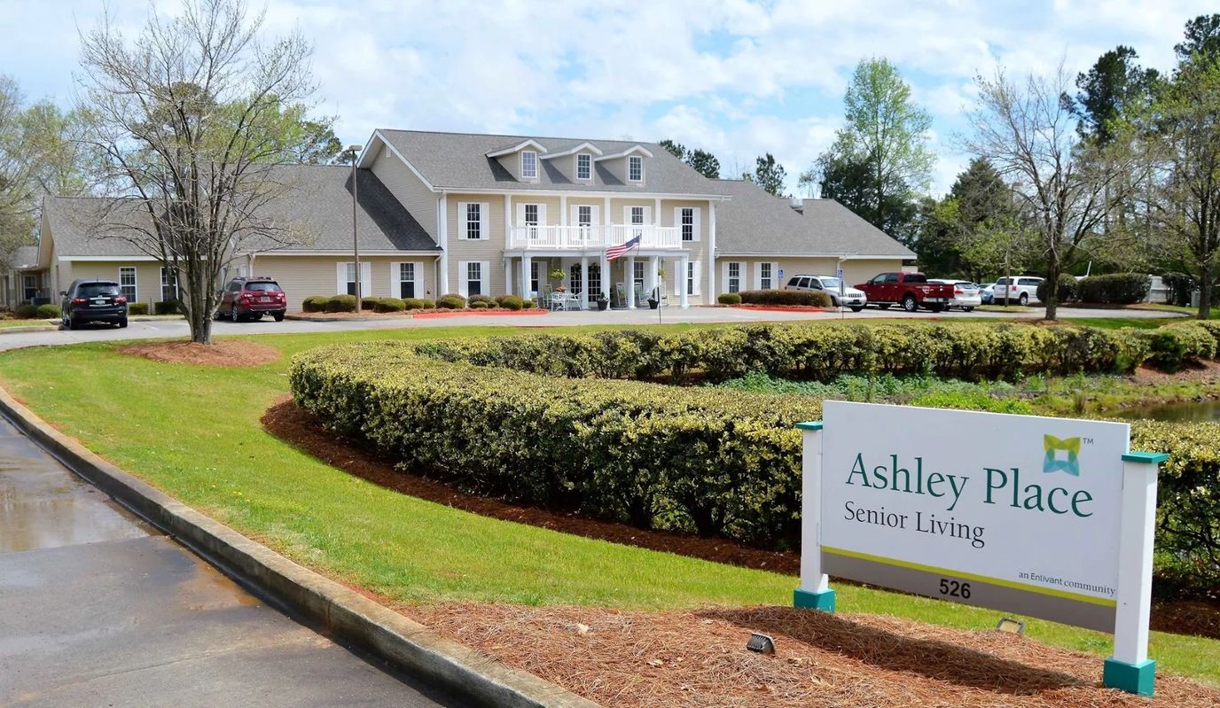 Exterior view of Ashley Place Senior Living with sign
