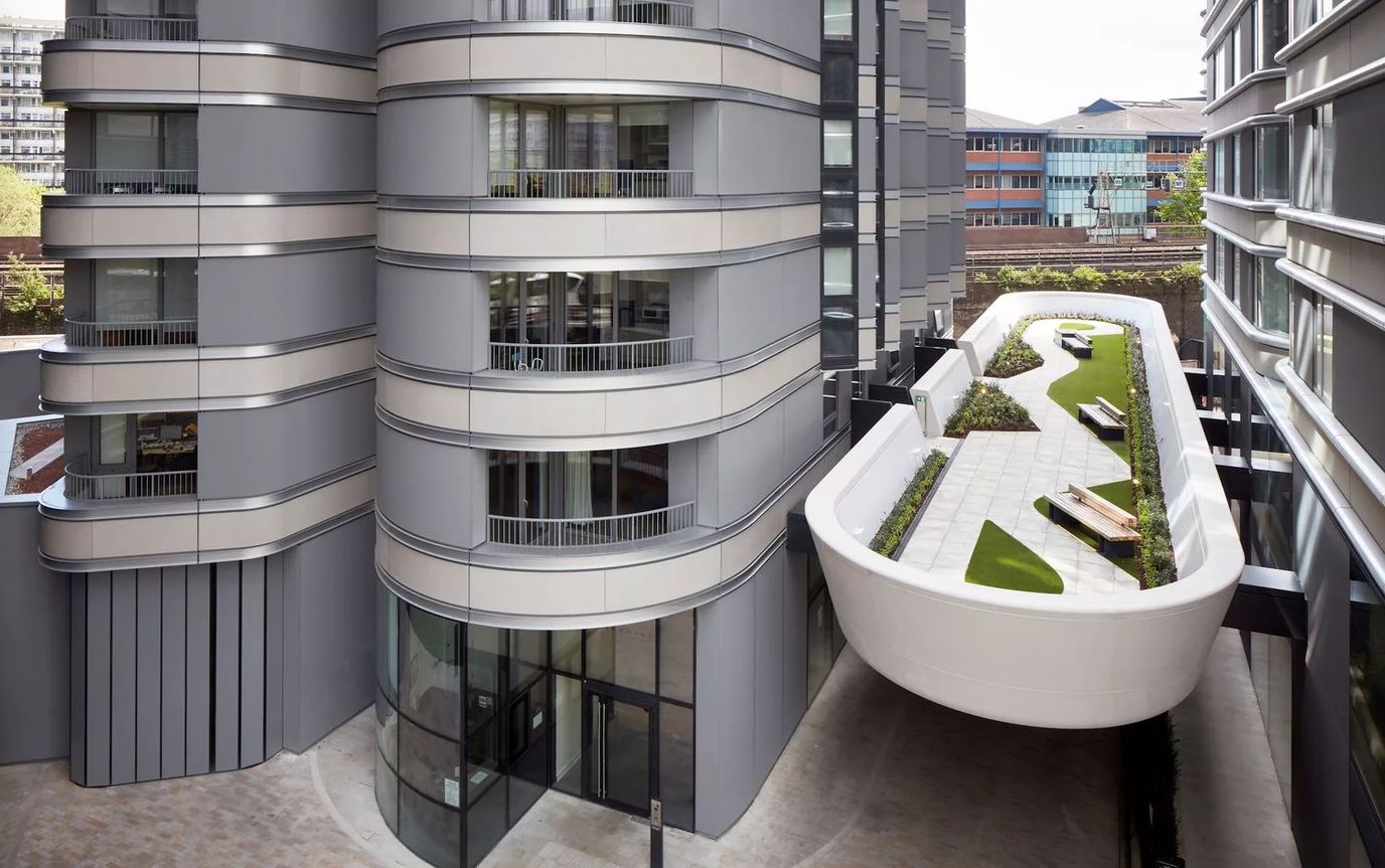 Exterior view of a modern assisted living facility with outdoor space