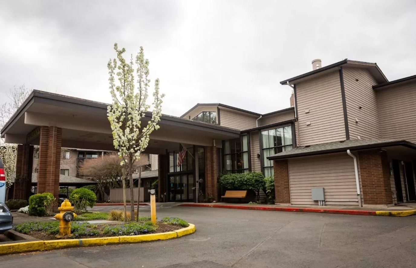 Exterior view of Beaverton Lodge with landscaping