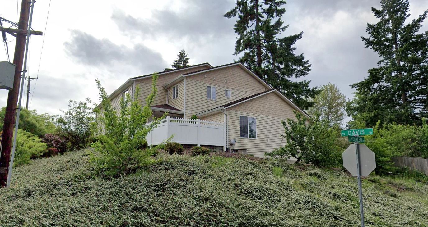 Exterior view of Beaverton Senior Care Home surrounded by greenery