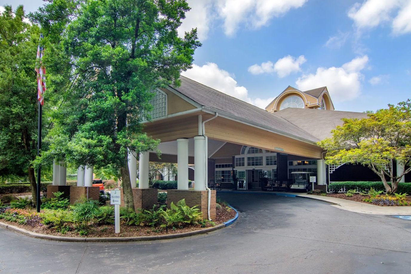 Entrance of a senior living facility with landscaping