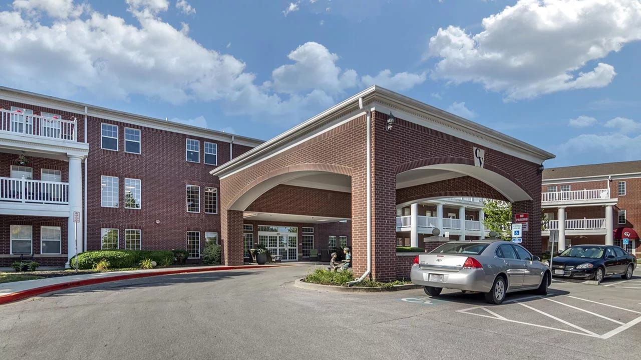 Entrance of a senior living facility with a covered driveway