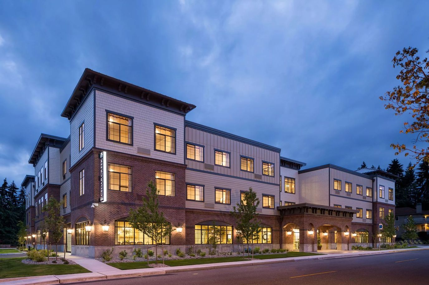 Exterior view of Cedar Creek Memory Care Community at dusk