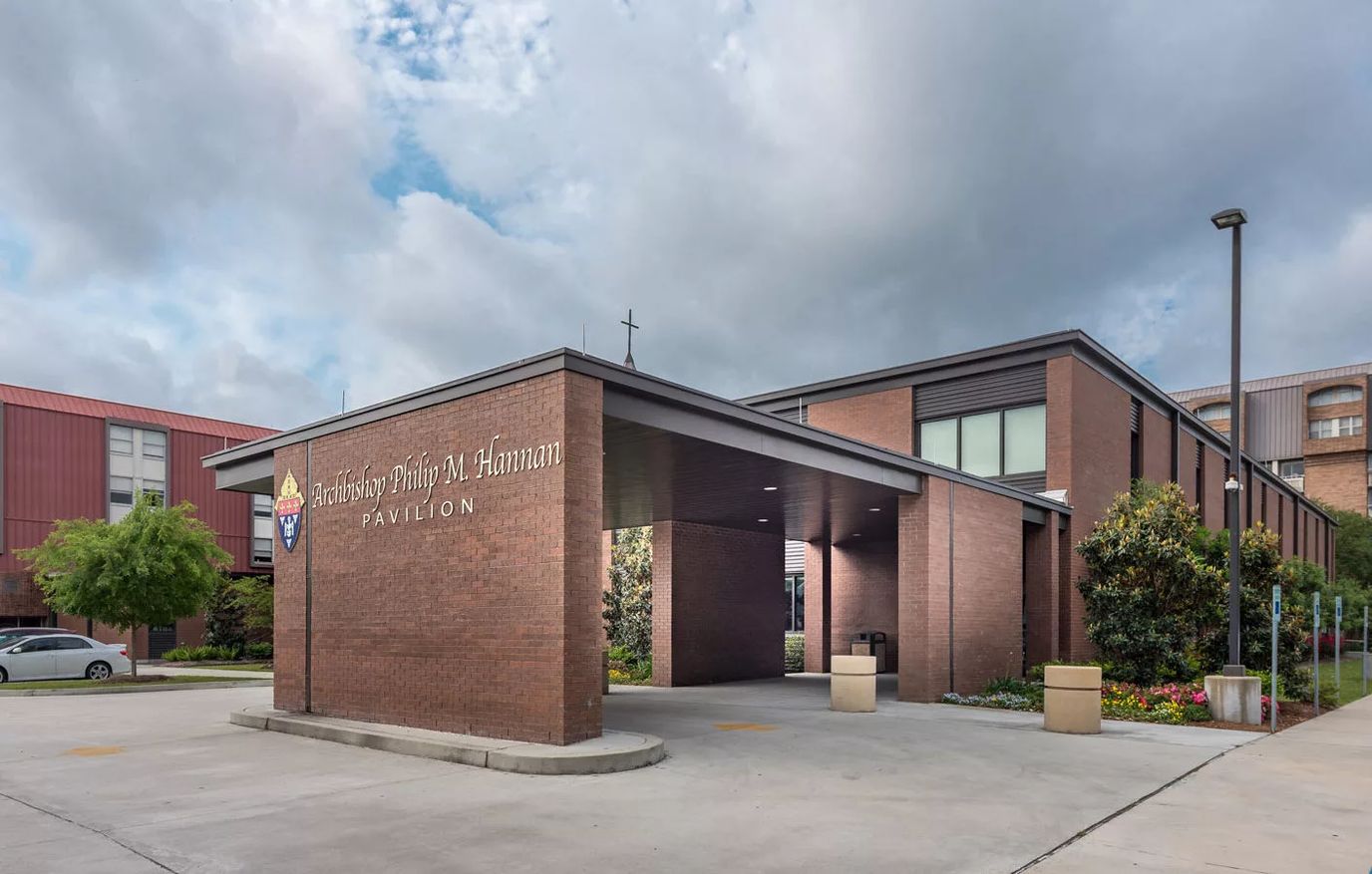 Building exterior with entrance and landscaping
