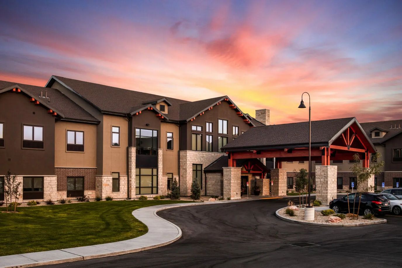 Exterior view of Copper Creek Senior Living at sunset