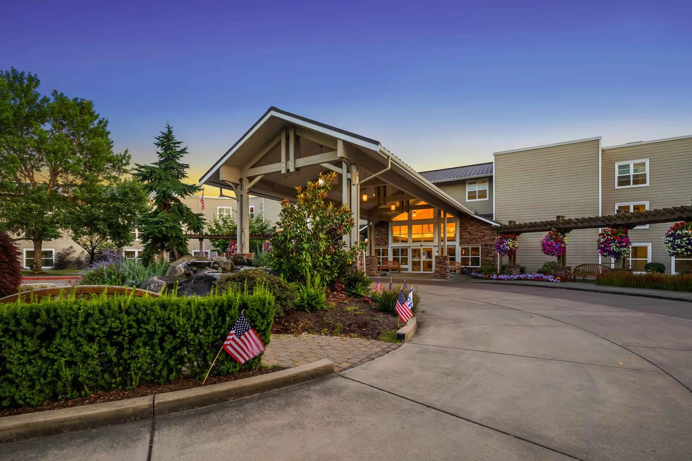 Entrance of Crista Shores with landscaping and flags