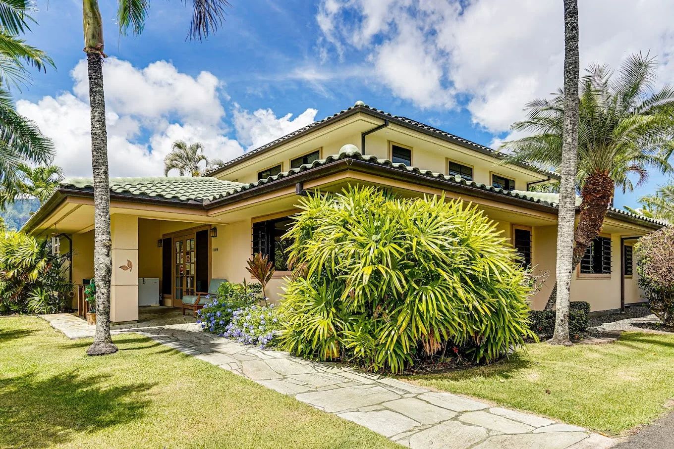 Exterior view of Kīnā ‘Ole Estate surrounded by landscaping