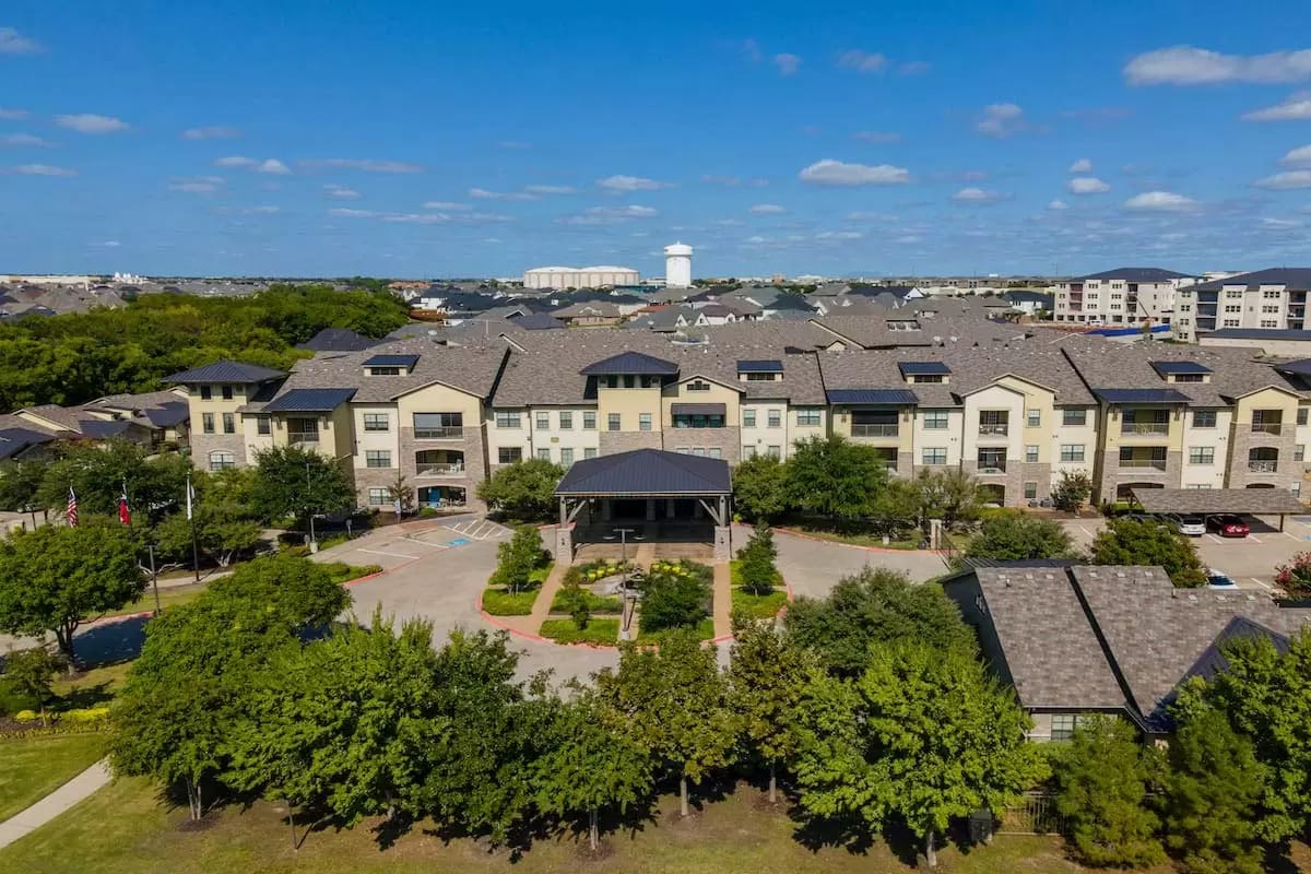 Aerial view of the building exterior surrounded by greenery