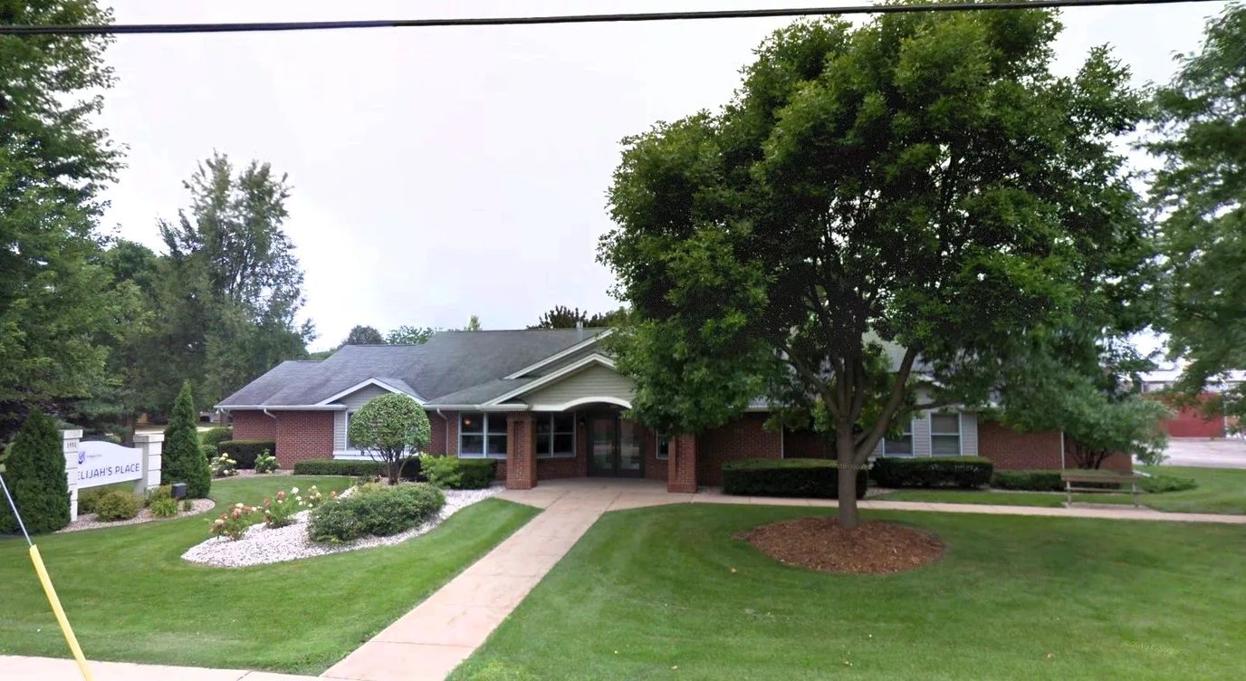 Exterior view of Elijah's Place facility with landscaped garden
