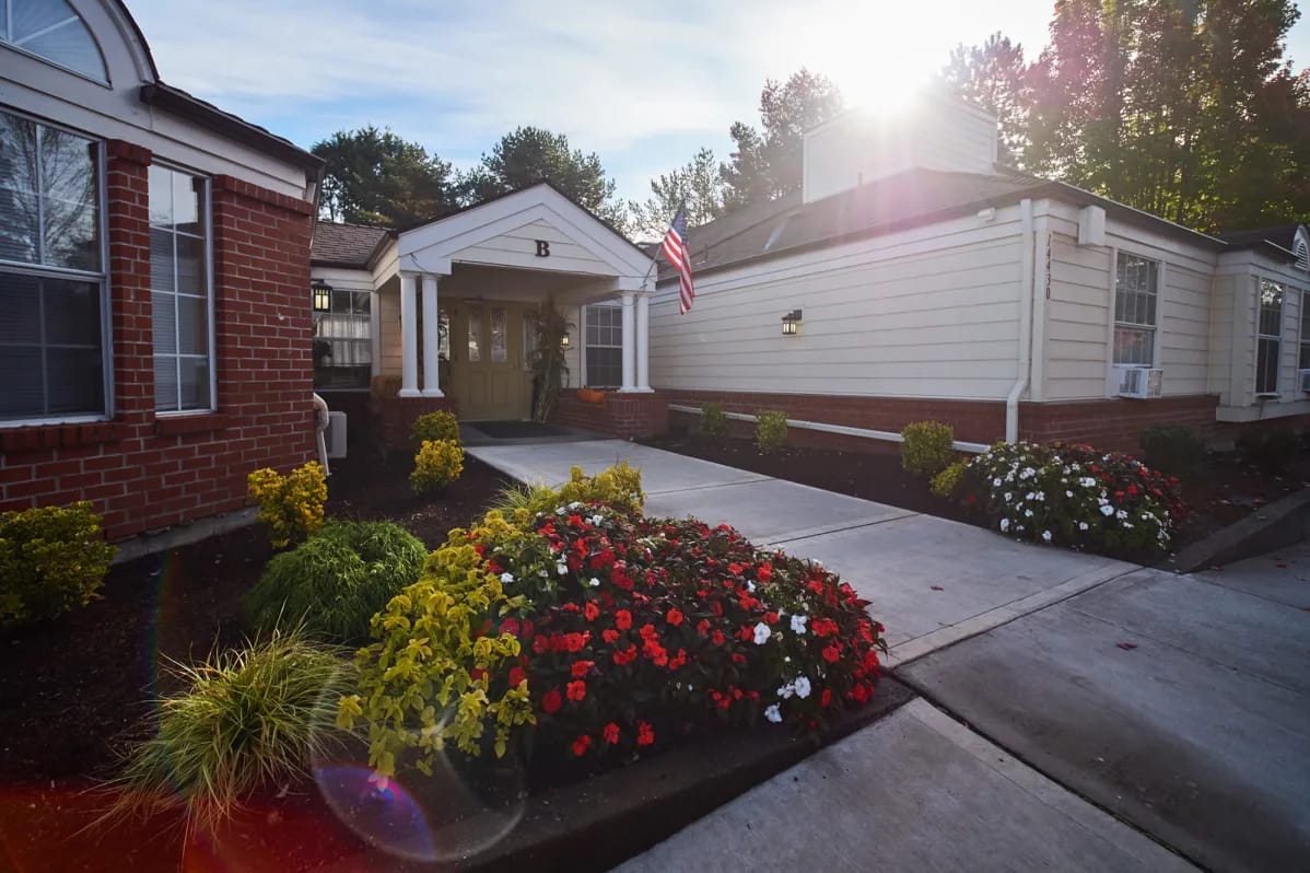 Exterior view of the facility entrance with flowers