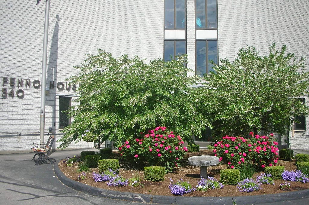Flowers and greenery at the entrance of Fenno House