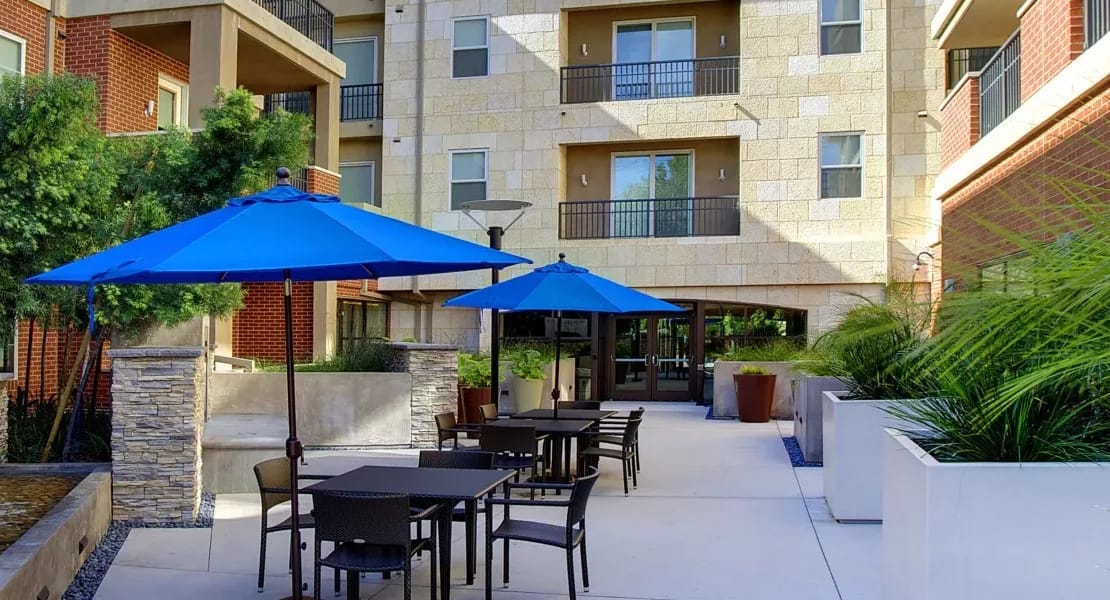Outdoor seating area with umbrellas and landscape
