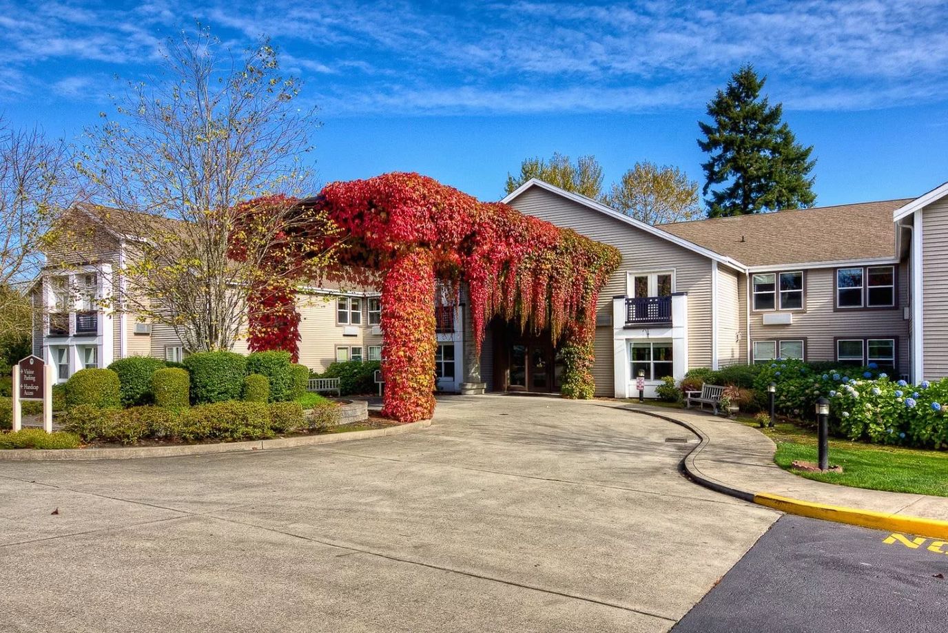 Entrance of GenCare Lifestyle Federal Way with colorful foliage