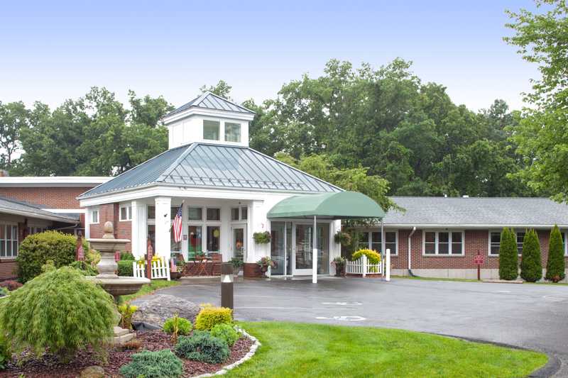 Exterior view of Glen Hill Center with landscaped entrance