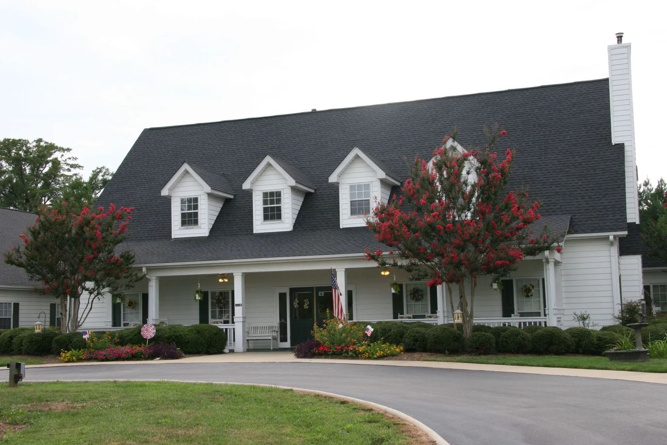 Exterior view of Greenville Glen with landscaped entrance
