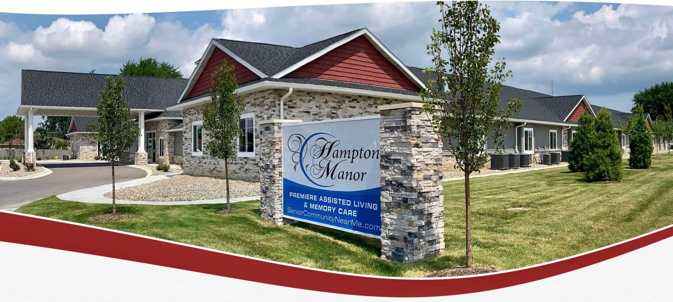 Exterior view of Hampton Manor building with signage