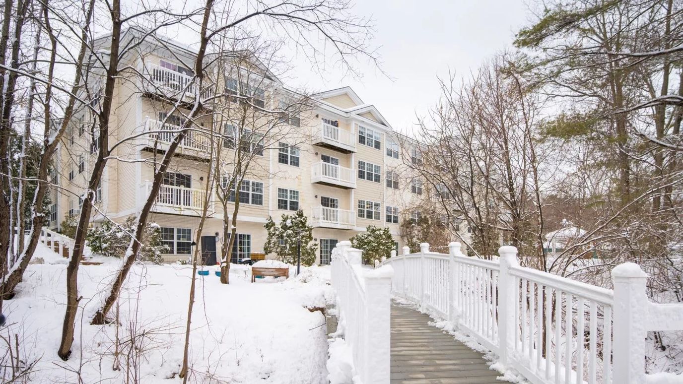 Exterior view of Harbor Village Senior Communities in winter