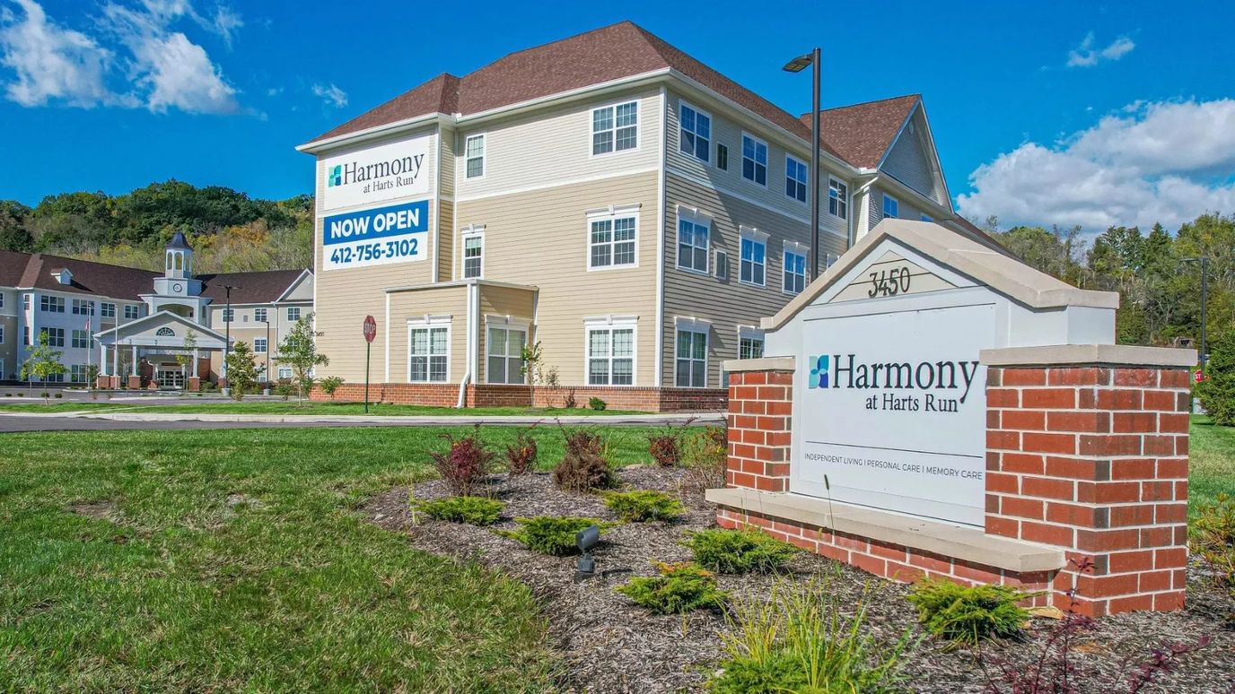 Exterior view of Harmony at Harts Run facility with signage