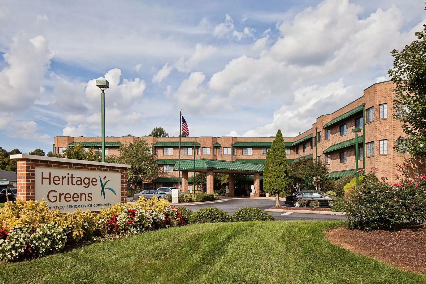 Exterior view of Heritage Greens facility with landscaping