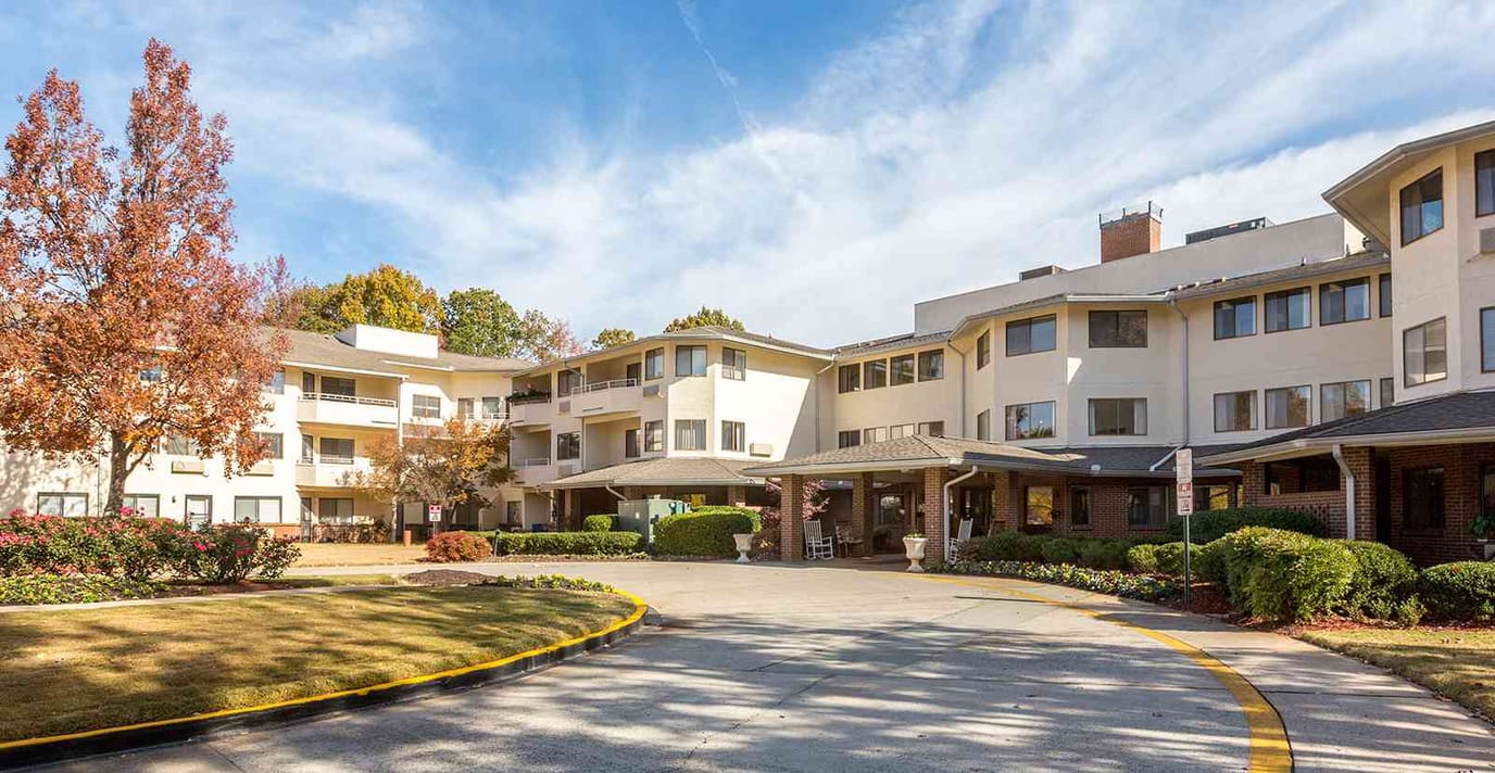 Exterior view of the Regency House facility with gardens