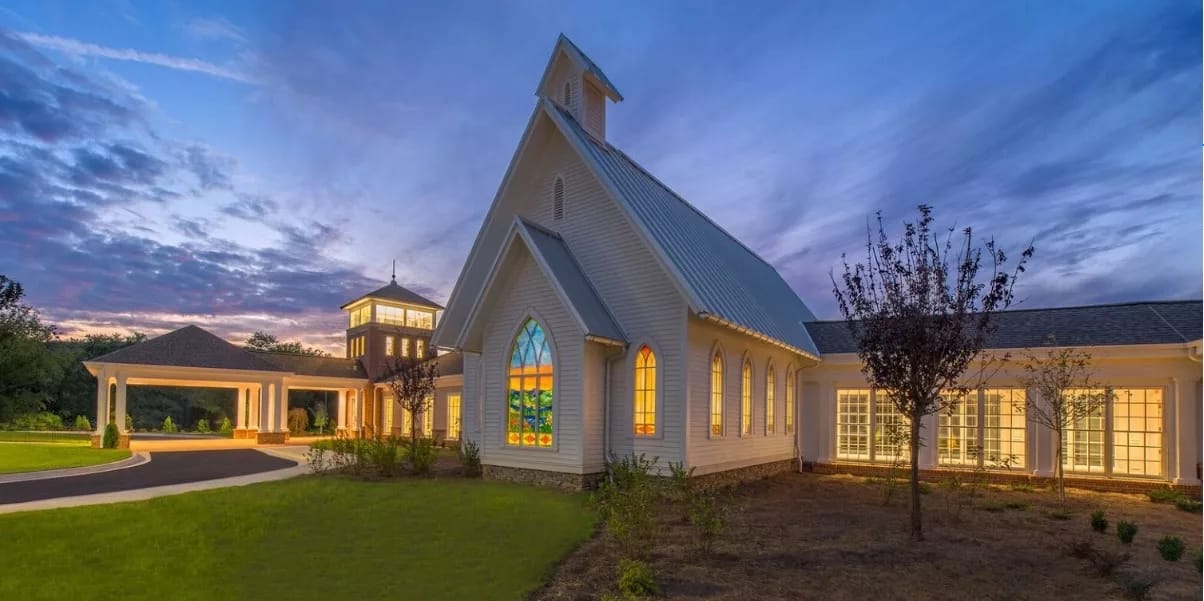 Exterior view of a senior living facility at dusk