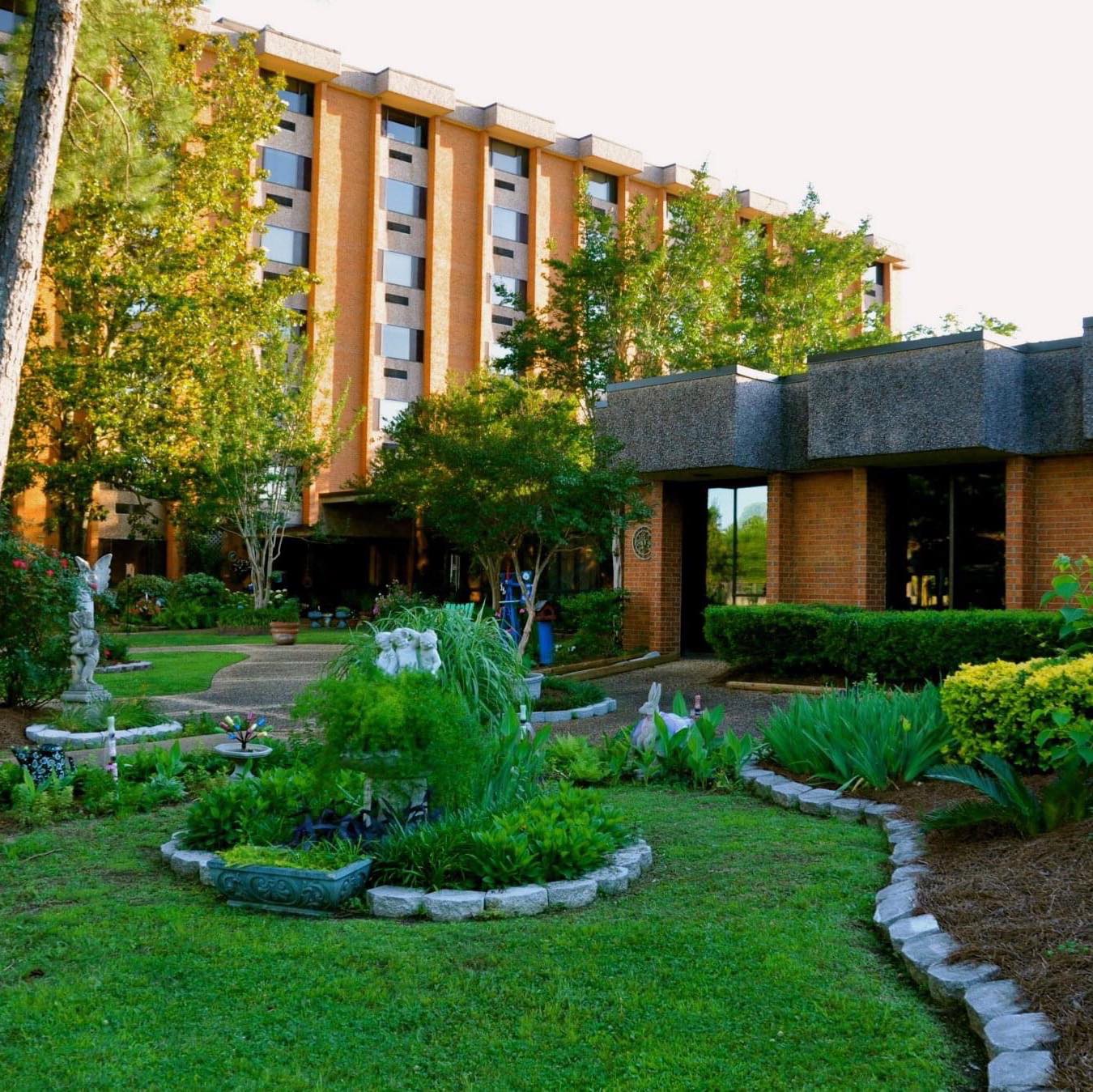 Exterior view of a retirement community with gardens