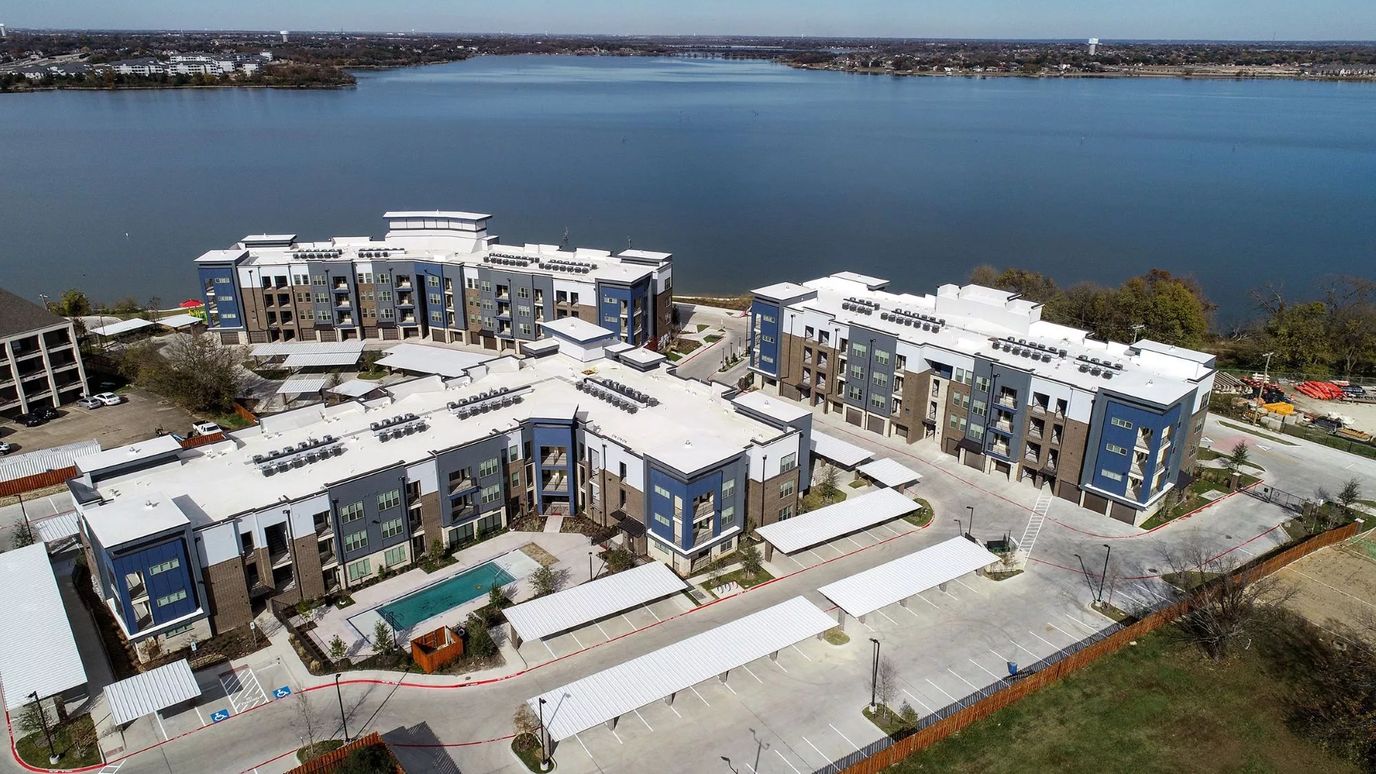 Aerial view of Lakeview Pointe 55+ Community by a lake