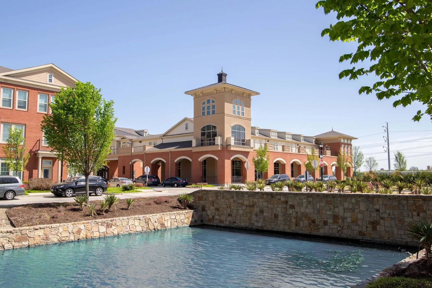 Exterior view of Landing at Watermere Frisco with water feature
