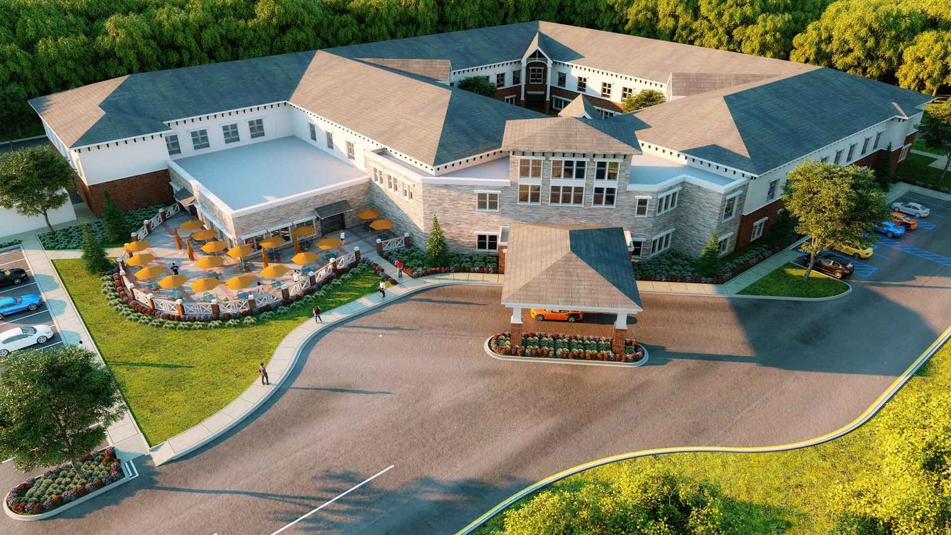 Aerial view of a senior living facility with outdoor seating