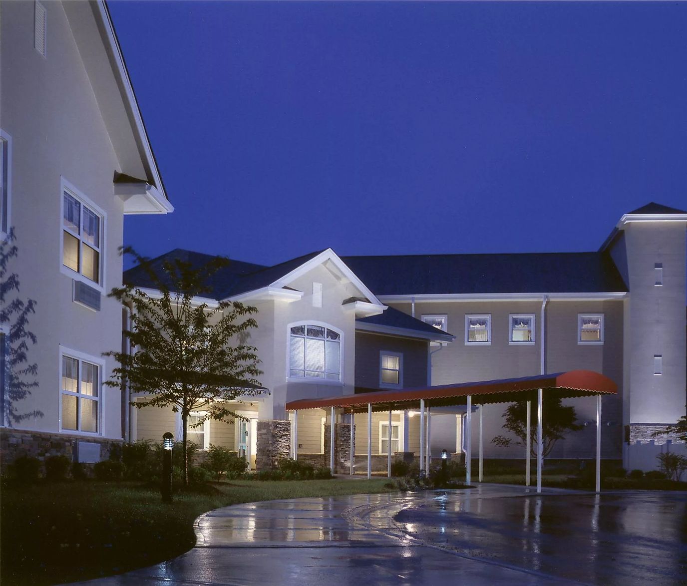 Exterior view of assisted living facility at night