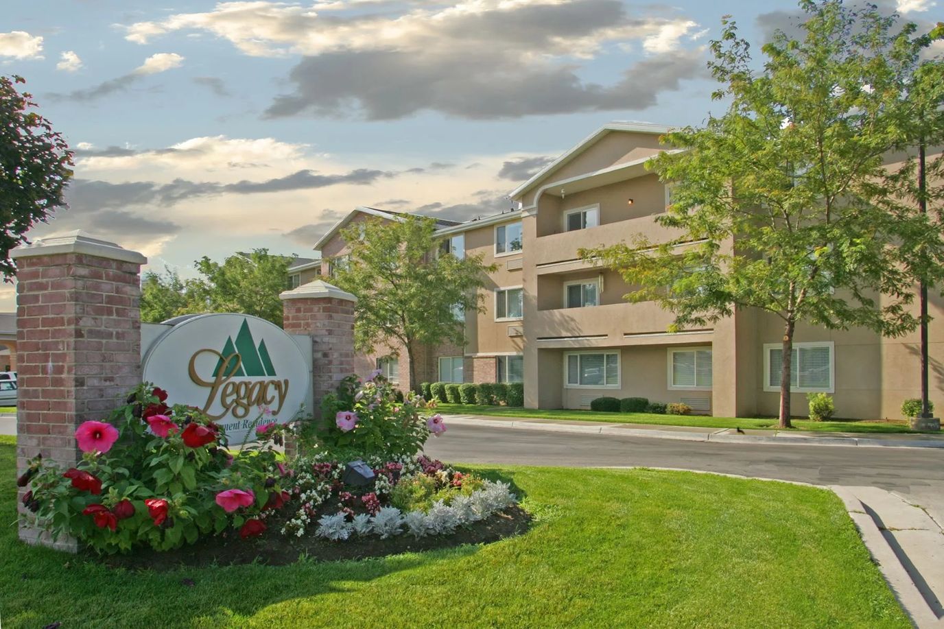Exterior view of Legacy Retirement Residence with landscaping