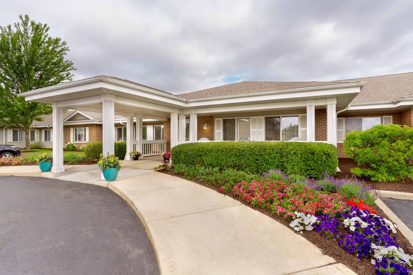 Entrance of the Library Terrace Apartment facility with flowers