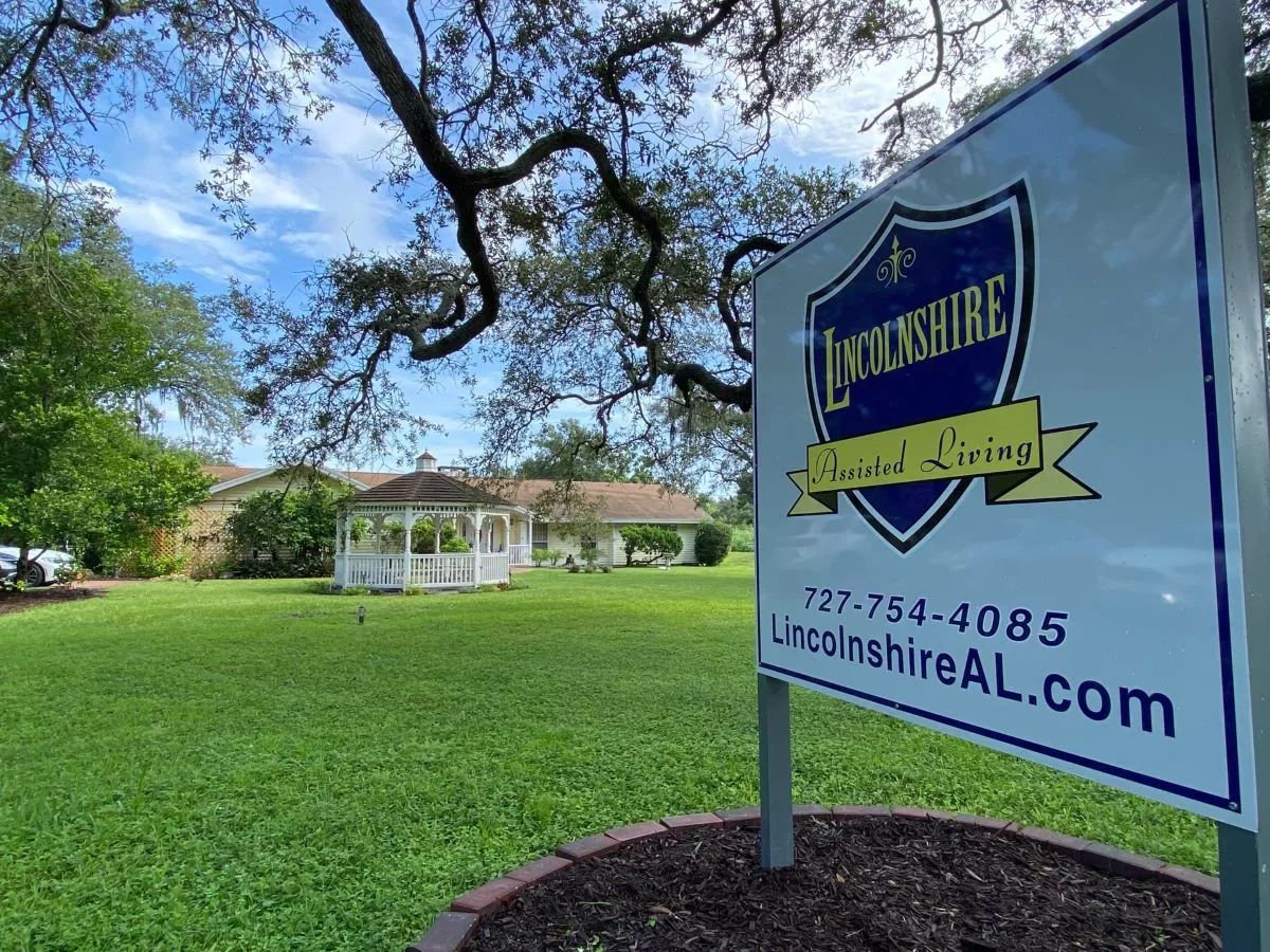 Exterior view of Lincolnshire Assisted Living with gazebo