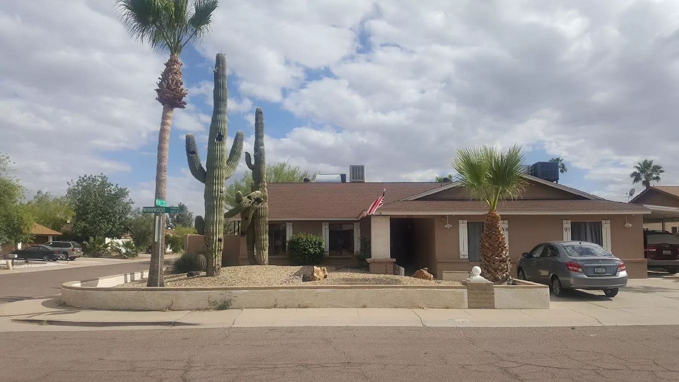 Exterior view of Living Waters Assisted Living Home with landscaping