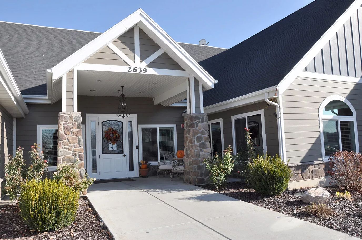 Entrance of Lotus Park Senior Living with decorative plants