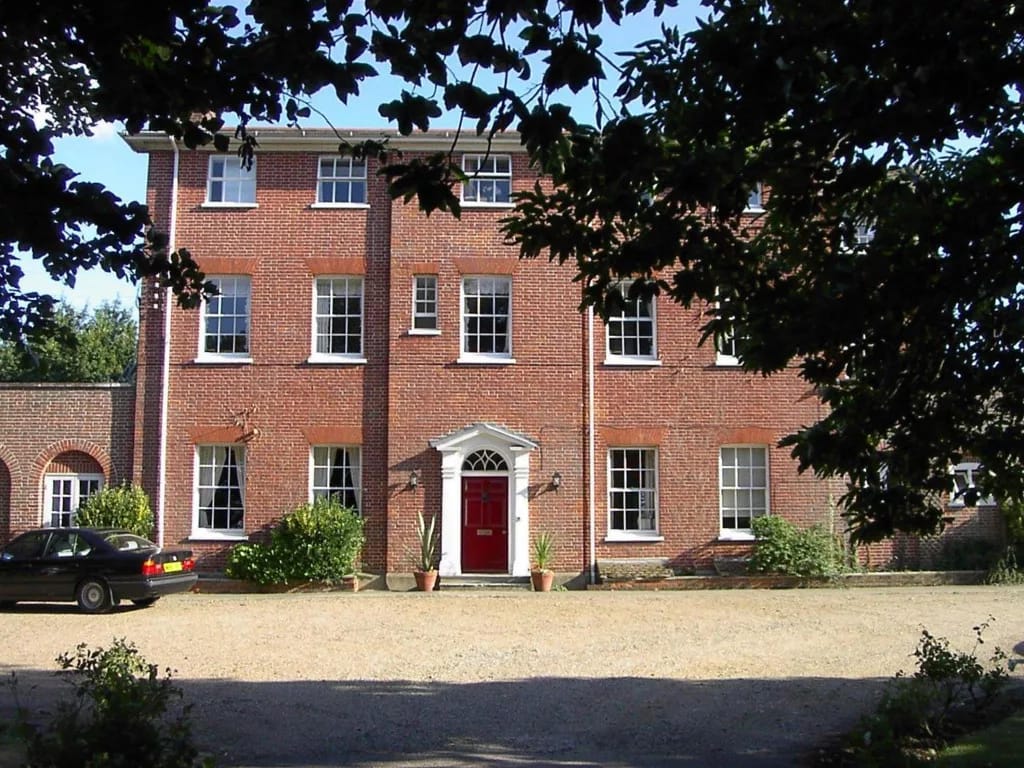 Exterior view of a nursing home with brick facade