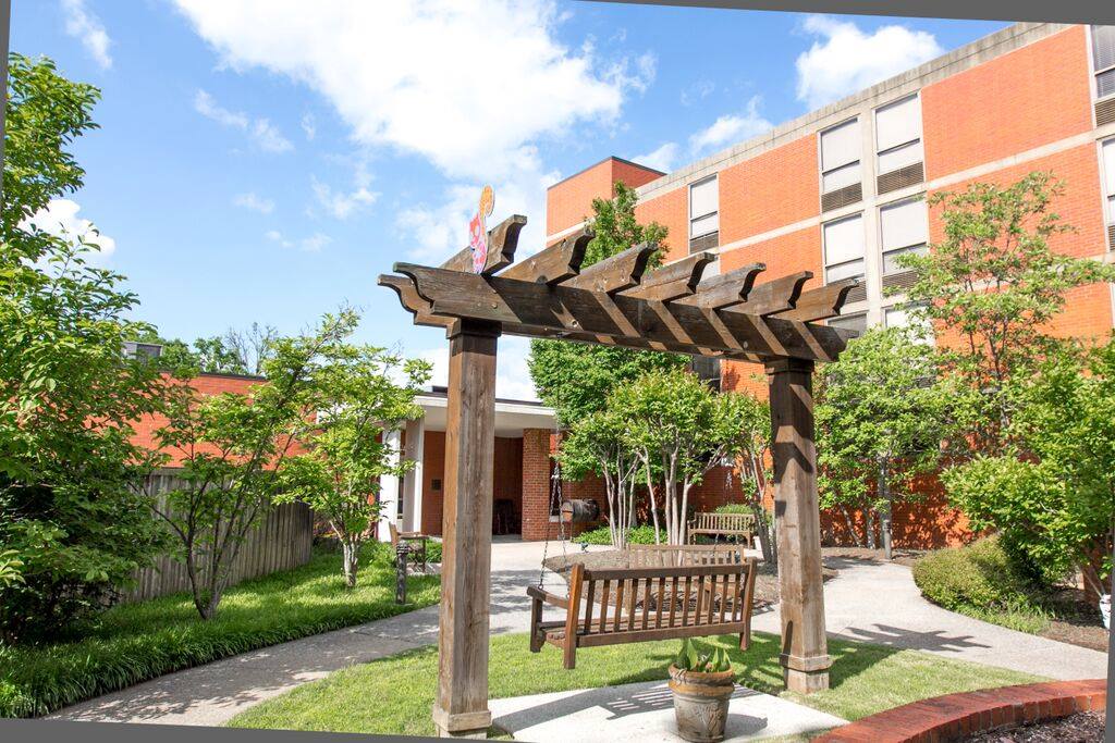 Exterior view of the facility's garden area with arbor