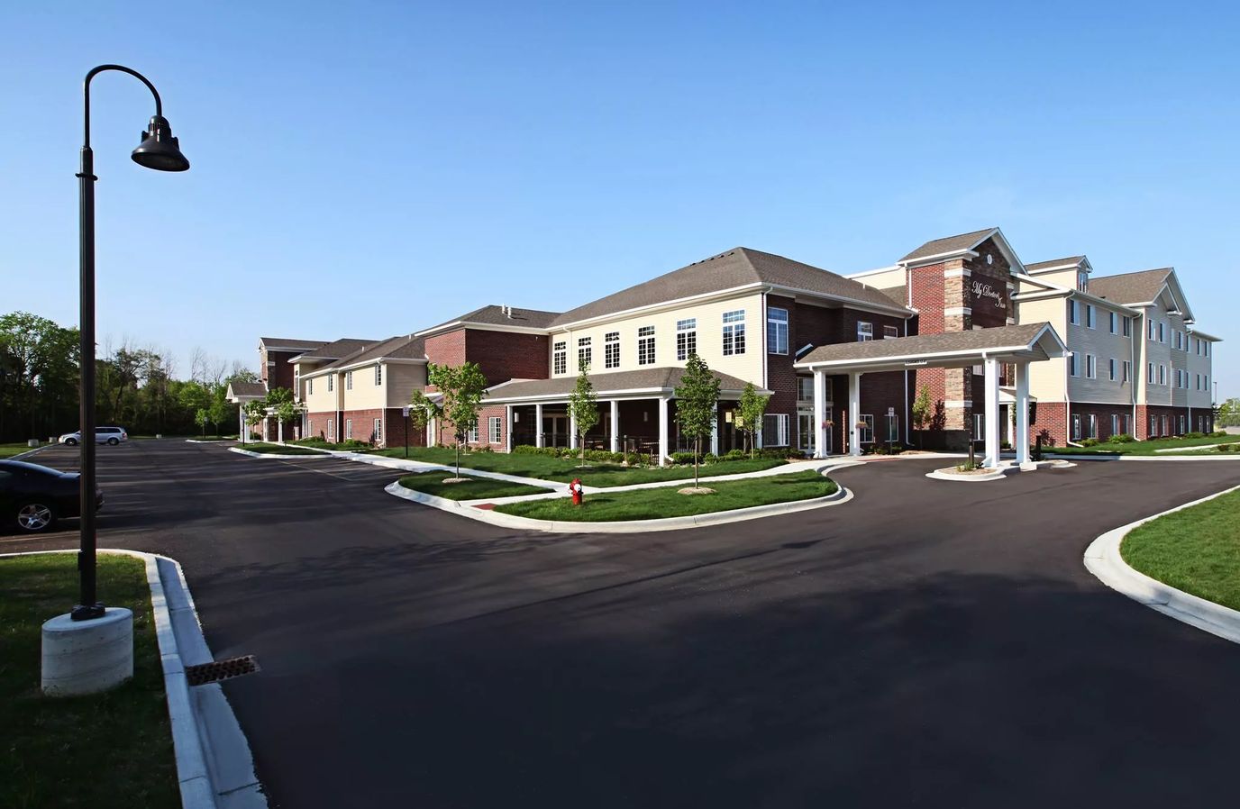 Exterior view of the facility with landscaped grounds