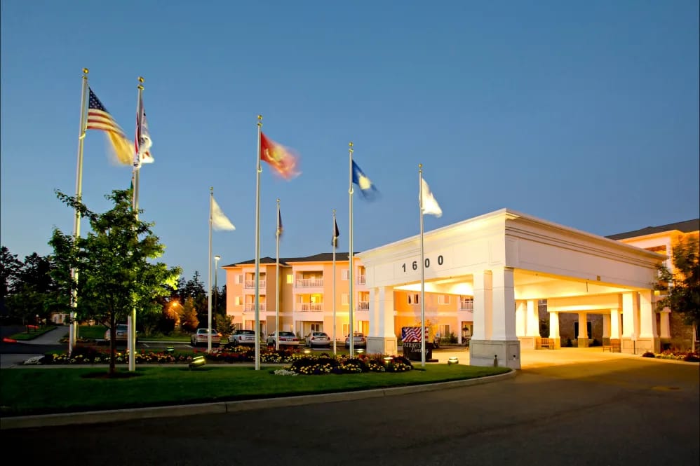 Exterior view of the facility's entrance with flags