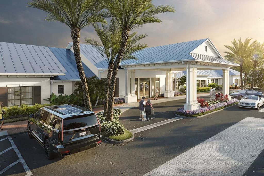 Building entrance with palm trees and vehicles in the parking lot