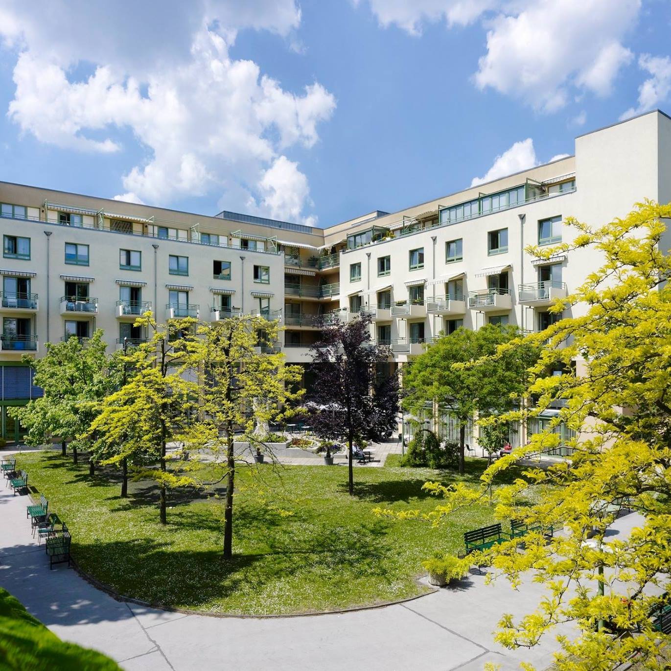 Exterior view of the retirement facility with gardens