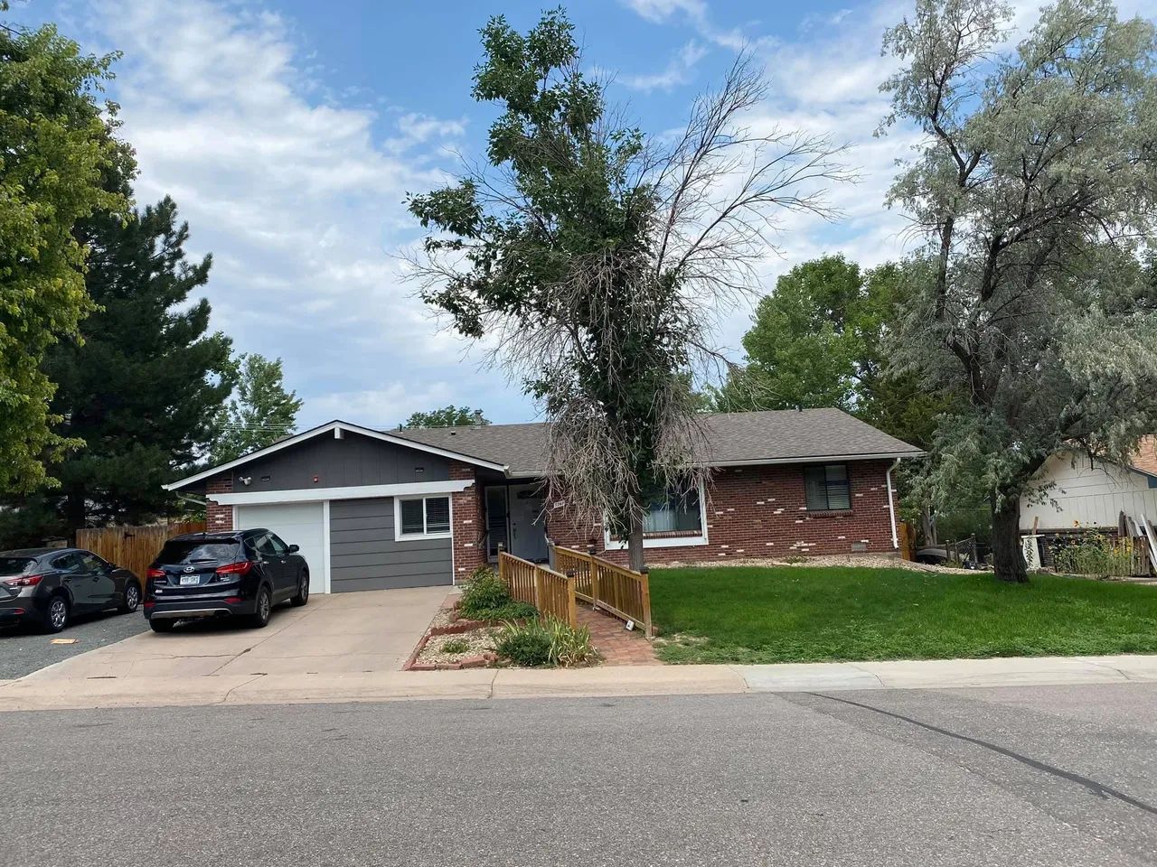 Exterior view of a single-family building with lawn