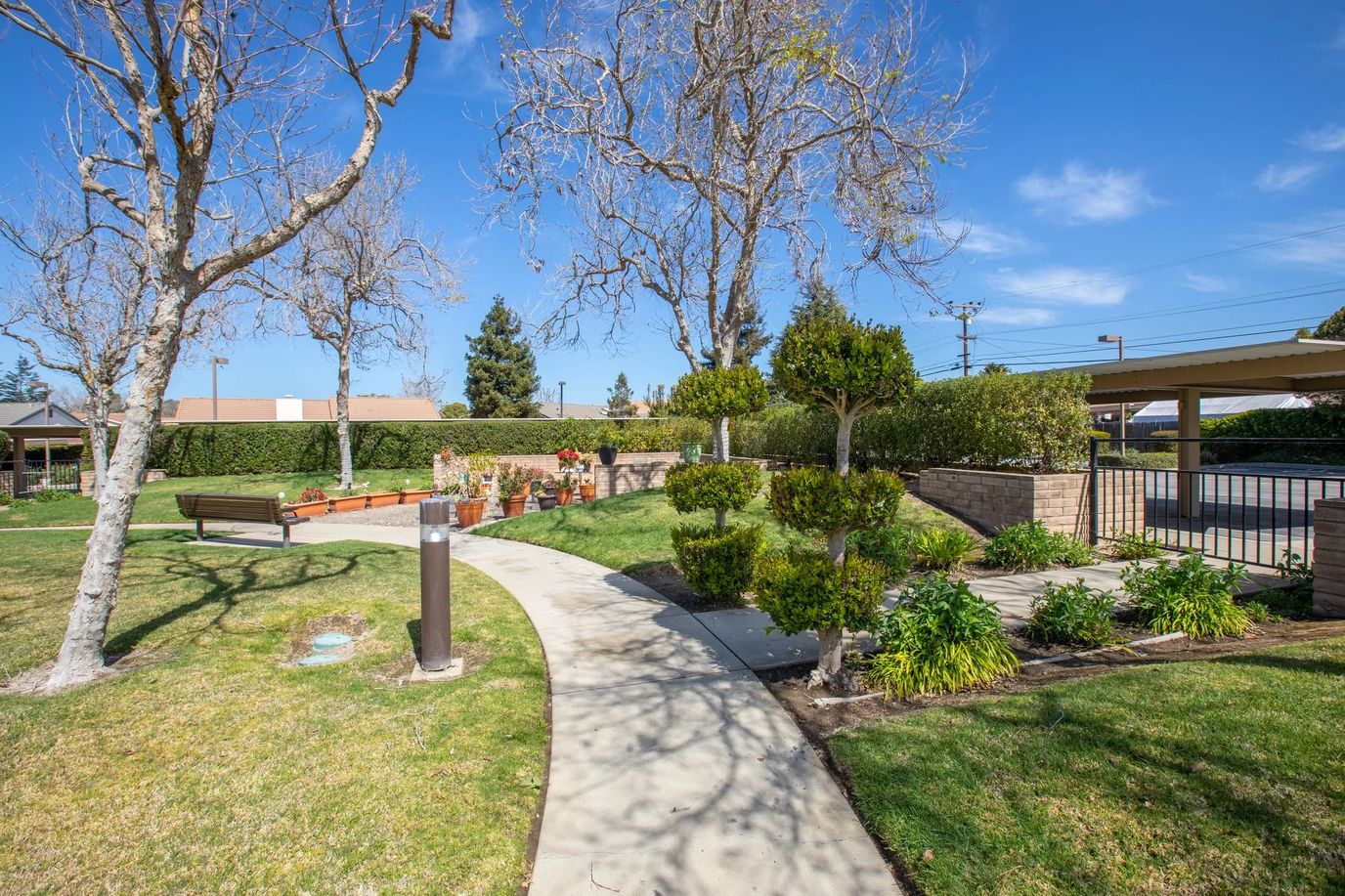 Well-maintained garden pathway in a senior living facility