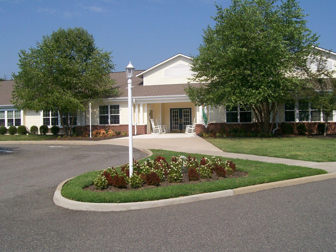 Exterior view of assisted living facility with landscaping