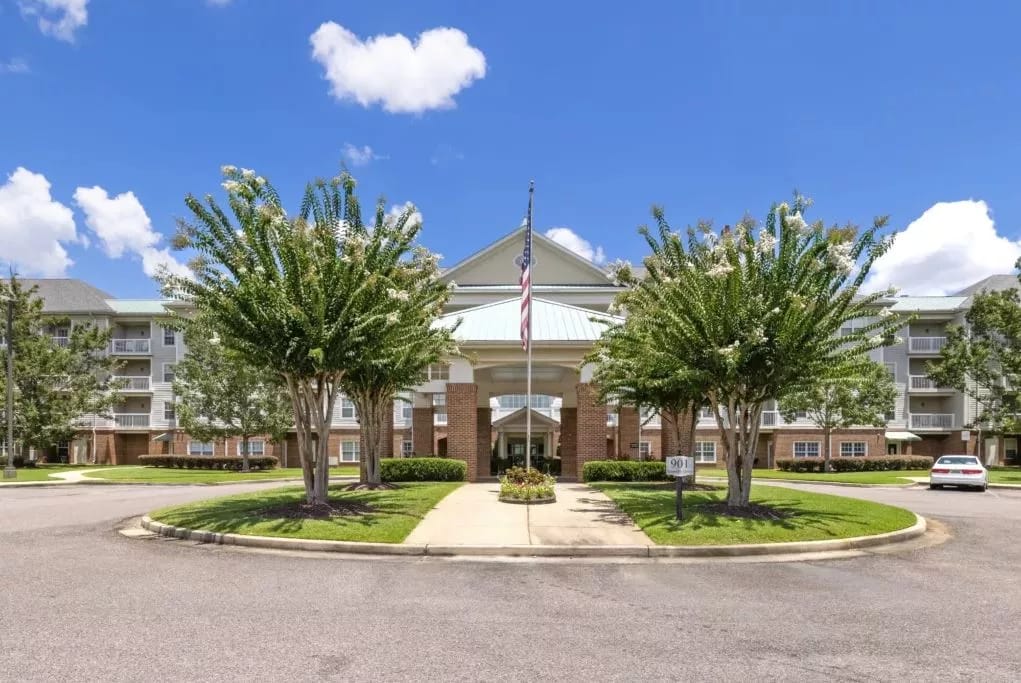 Exterior view of the assisted living facility with landscaping