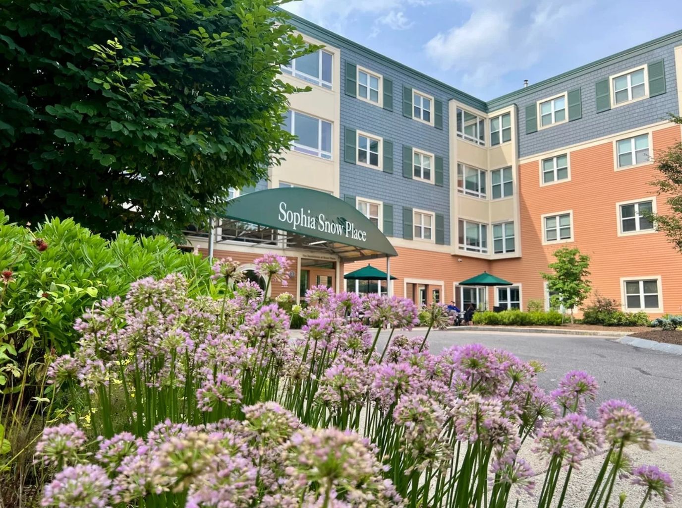 Exterior view of Sophia Snow Place with flowers