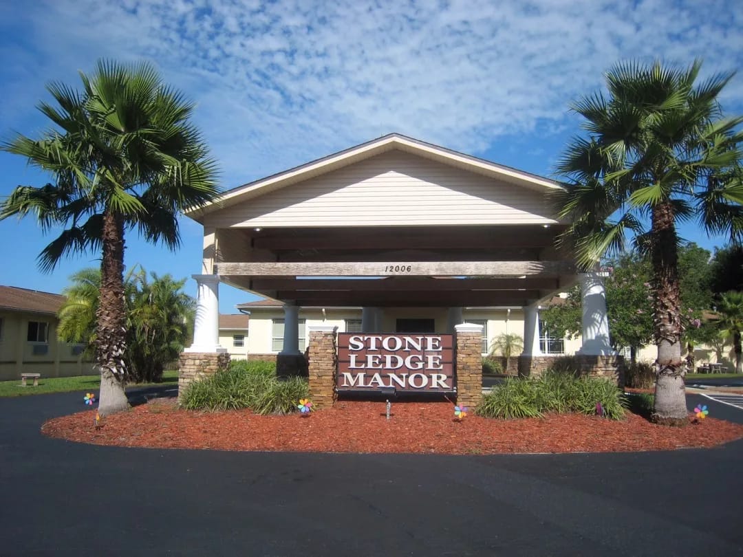Exterior view of Stone Ledge Manor with landscaping