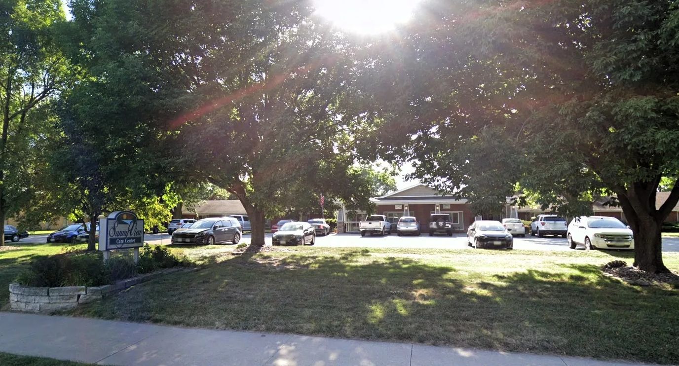 Exterior view of Sunny View Care Center with parking lot