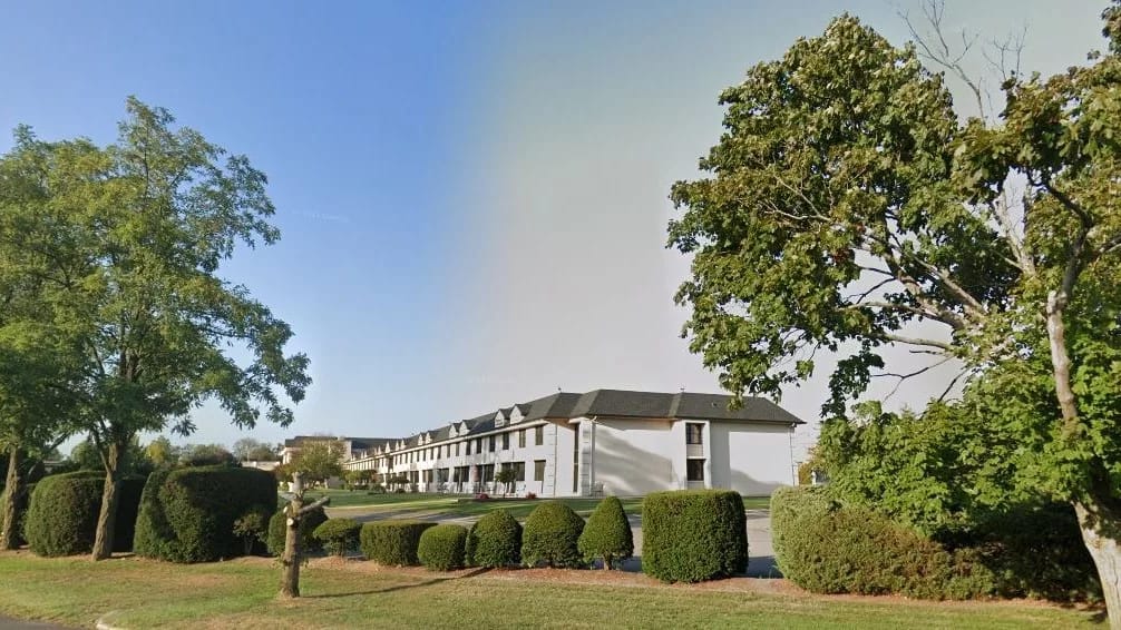 Exterior view of The Arbors at Hauppauge with landscaping
